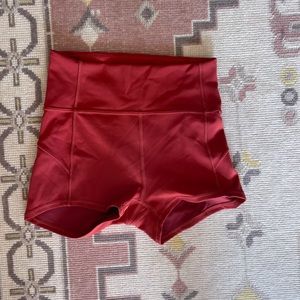 lululemon 2.5” spandex shorts in rust/burnt orange color size 4
